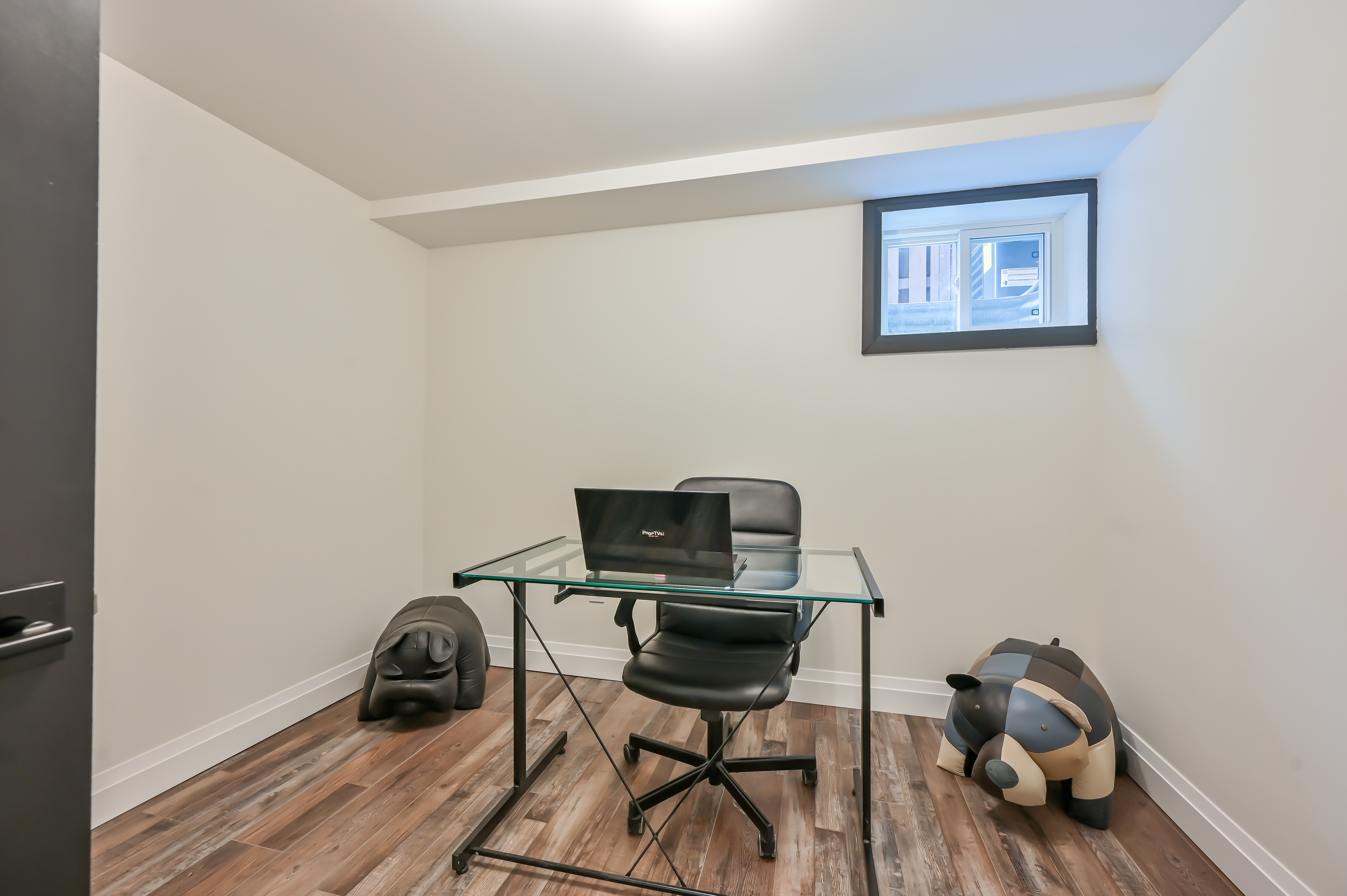 Clean finished basement office with quality flooring and trim work — excellent virtual tour shot for portfolio — Kron, Hamilton | MTC Renovations